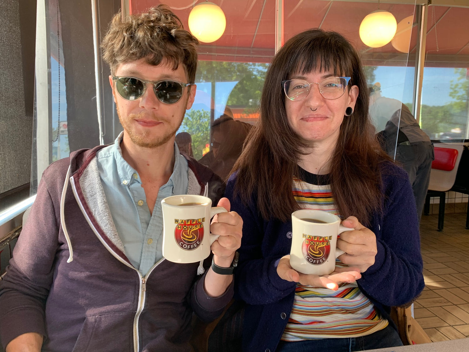 Michael and Mandy waking up with a Waffle House coffee.