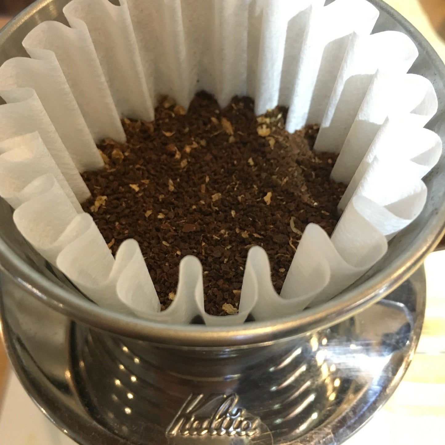 Kalita Wave 185 ready to brew with fresh coffee grounds.
