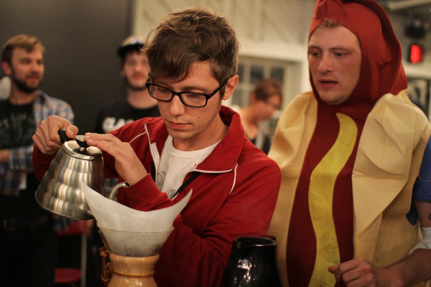 Michael brewing a Chemex at Barista Camp alongside a human hot dog.