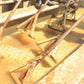 Parchment coffee being soaked and turned with wooden rakes.