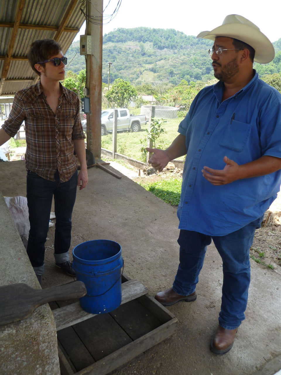 Michael learning from Sr. Arnold Paz, coffee producer from Honduras