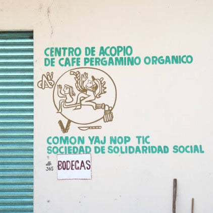 Spanish language sign for organic pergamino coffee collecting