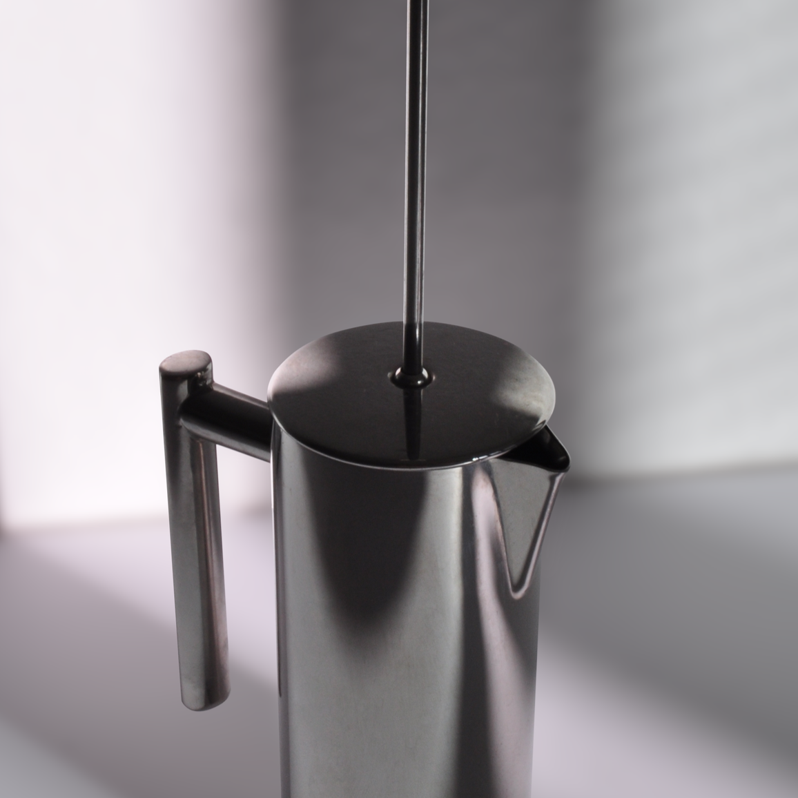 Close-up of stainless steel press pot.
