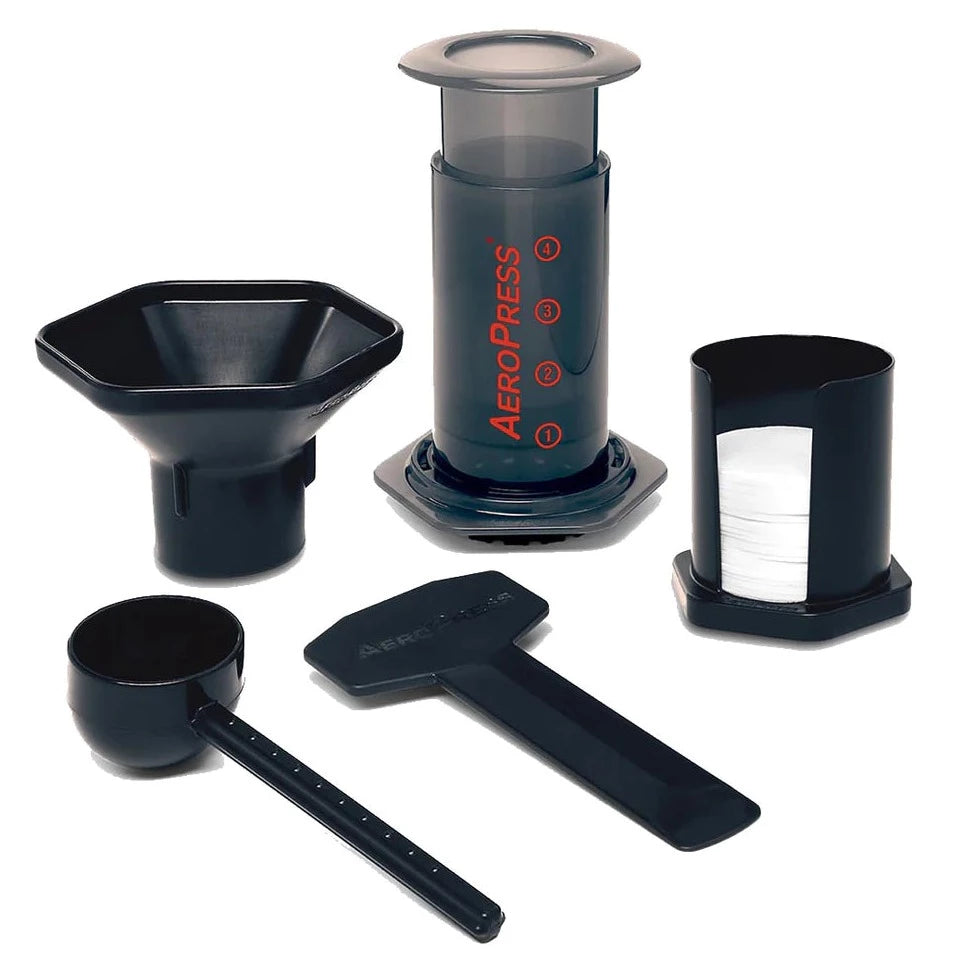 Photo courtesy of Espresso Parts. Image shows Aeropress, funnel, measuring cup, stirrer, and filters.